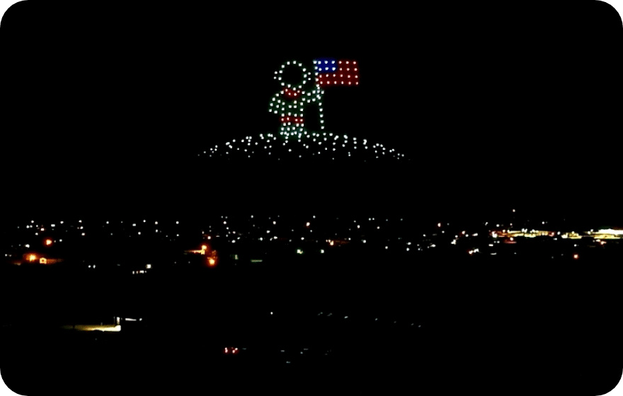 Night scene with illuminated astrounaut and American flag