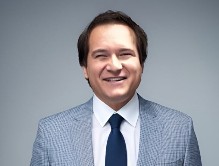 Smiling businessman in blue suit and tie