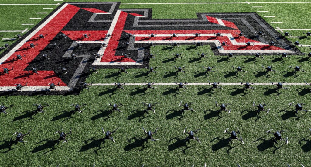 Marching band forming giant letter on football field