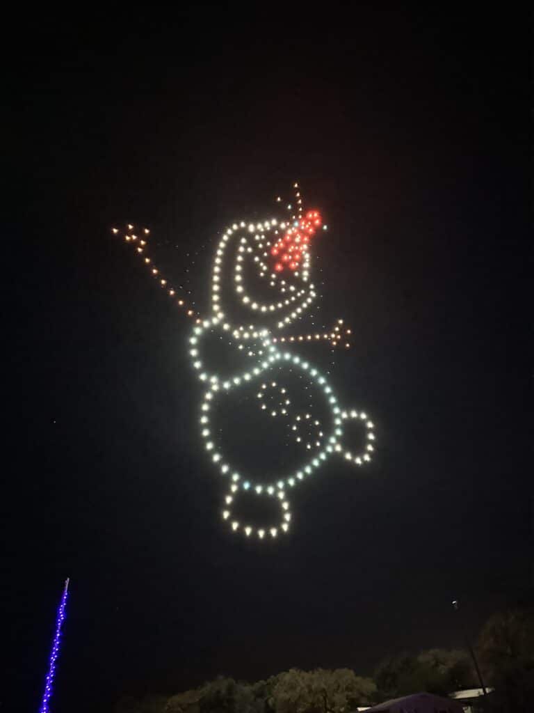 Illuminated snowman figure made of lights at night