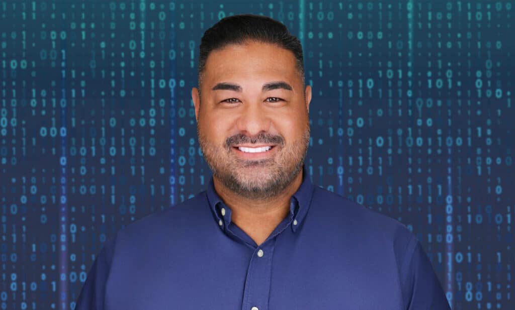 Smiling man with digital blue code background